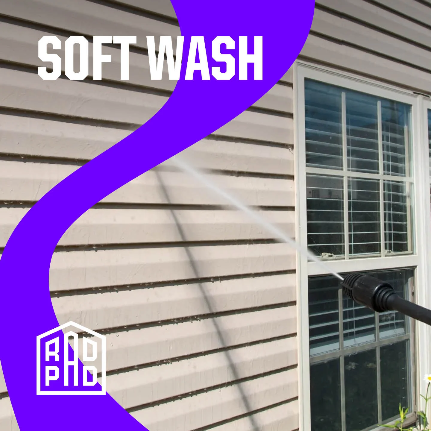 Clean vinyl siding and white-framed windows after soft wash cleaning service