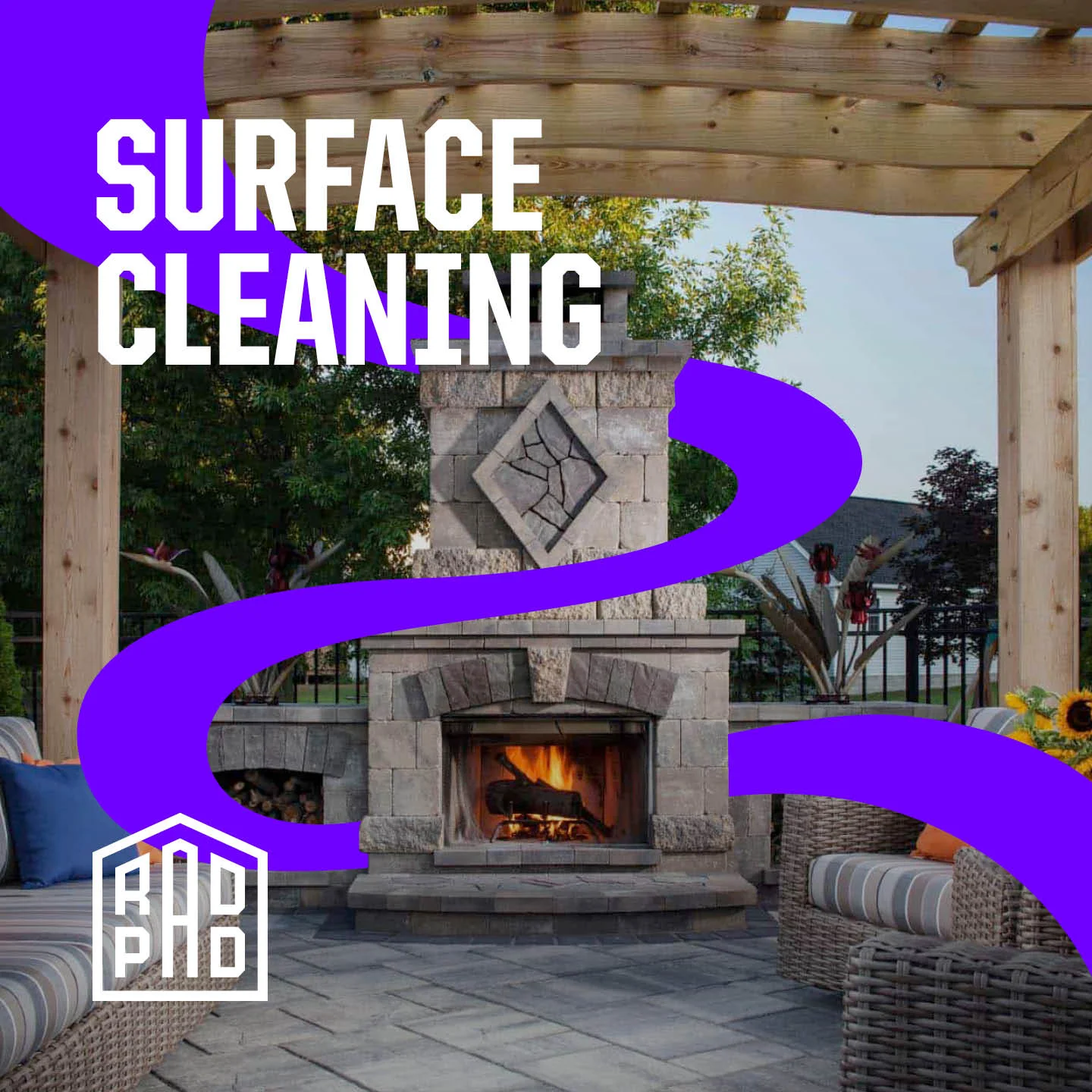 Clean stone fireplace with active fire under wooden pergola in outdoor patio setting